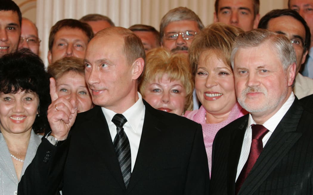 Russian President Vladimir Putin, Sergei Mironov, chairman of the Federation Council (from left to right, foreground) and St. Petersburg Governor Valentina Matviyenko (first right) after a ceremonial presenting of the certificate and badge of honorary citizen of St. Petersburg in the Mariinsky Palace in 2006.