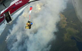 A smokejumper from West Yellowstone, Montana jumps the Bear Lake Fire, August 24, 2014