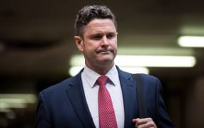 Chris Cairns heads into a London court to face trial for perjury.