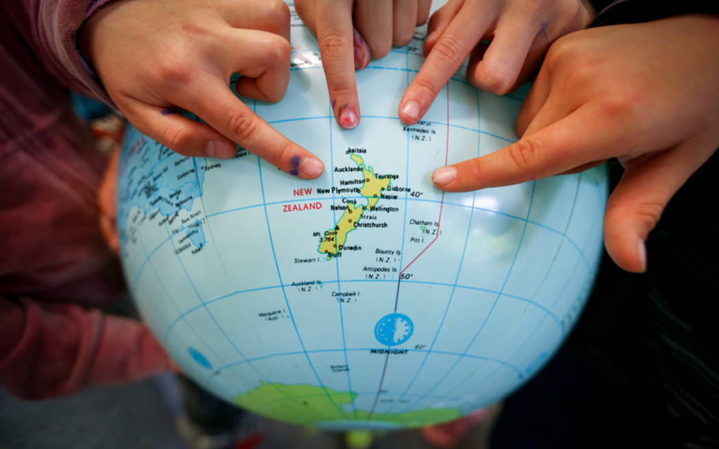 Kids at Hampton Hill Primary school pointing to New Zealand in regards to climate change.