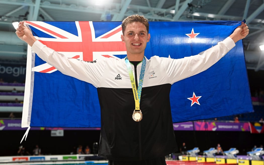 Lewis Clareburt of New Zealand celebrates with his gold medal