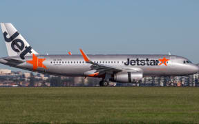 Sydney, Australia - May 5, 2014: Jetstar Airways Airbus A320 airliner landing at Sydney Airport.