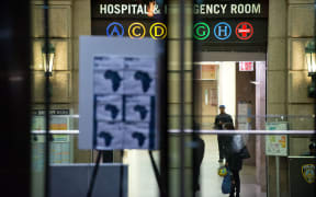 A health alert is displayed at the entrance to Bellevue Hospital where Dr Craig Spencer is being treated.