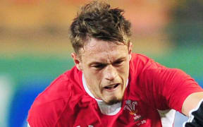 Cory Allen of Wales runs the ball. He scored a hat-trick against Uruguay.