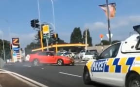 A red Holden sped across Auckland on 31 January as police chased after the car.