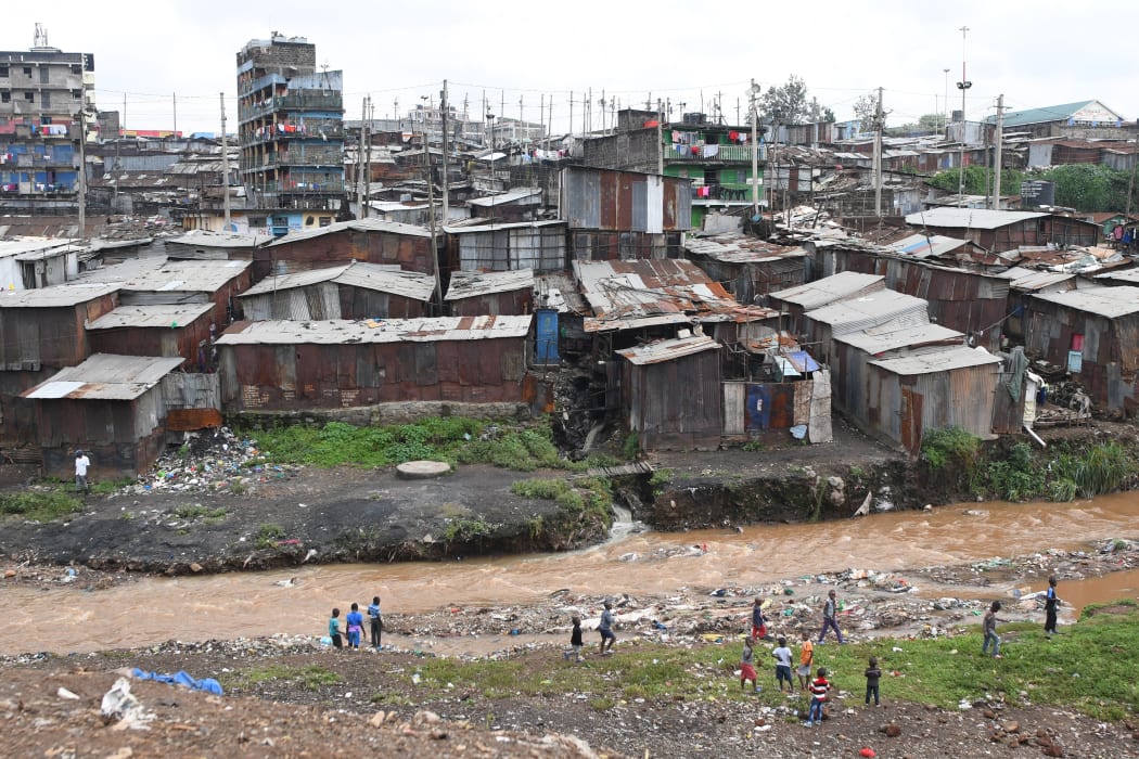Children play next to Nairobi river in the Mathare valley slum in Nairobi, Kenya. File photo