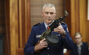 Police officer Paddy Hennan demostrates illegal gun modifications
