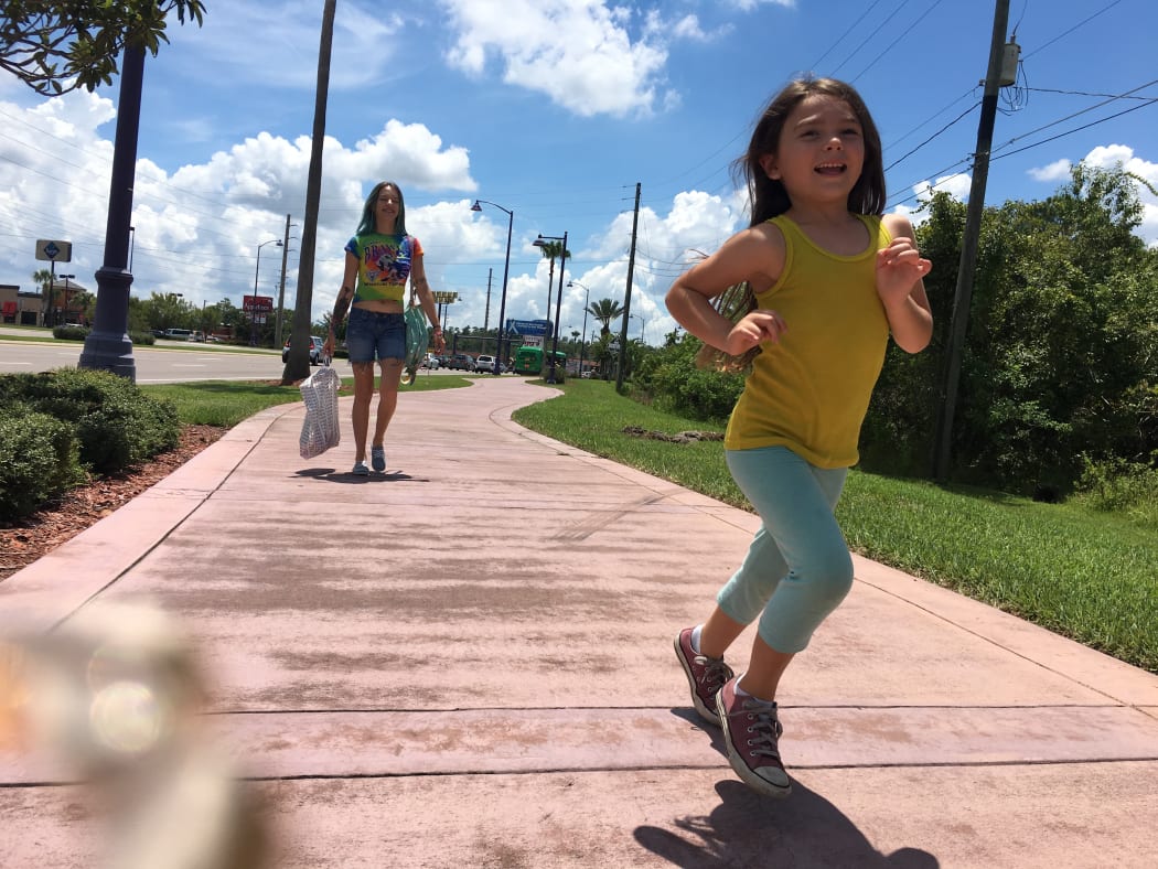 Bria Vinaite as Halley and Brooklynn Prince as Moonee (Halley’s daughter) in Sean Baker’s The Florida Project.