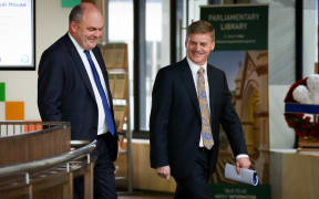 Steven Joyce (left) and Bill English arriving at the lock-up - where about 160 journalists and analysts are waiting.