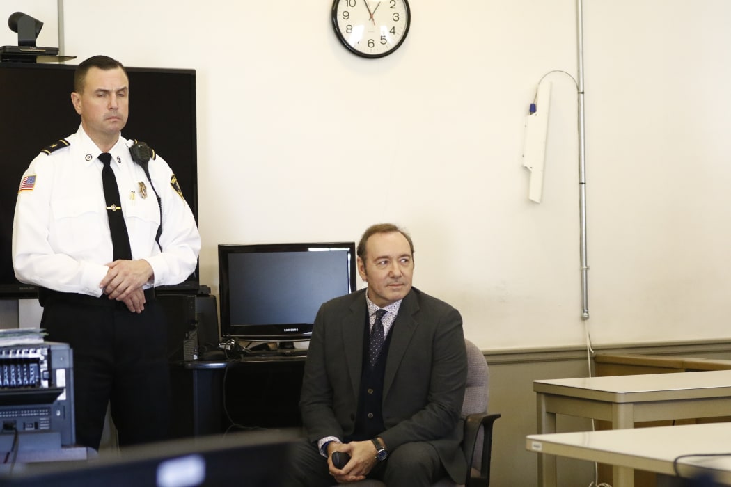 Kevin Spacey sits in chair while the legal teams meet during his arraignment at Nantucket District Court in Nantucket, Massachusetts on January 7, 2019.