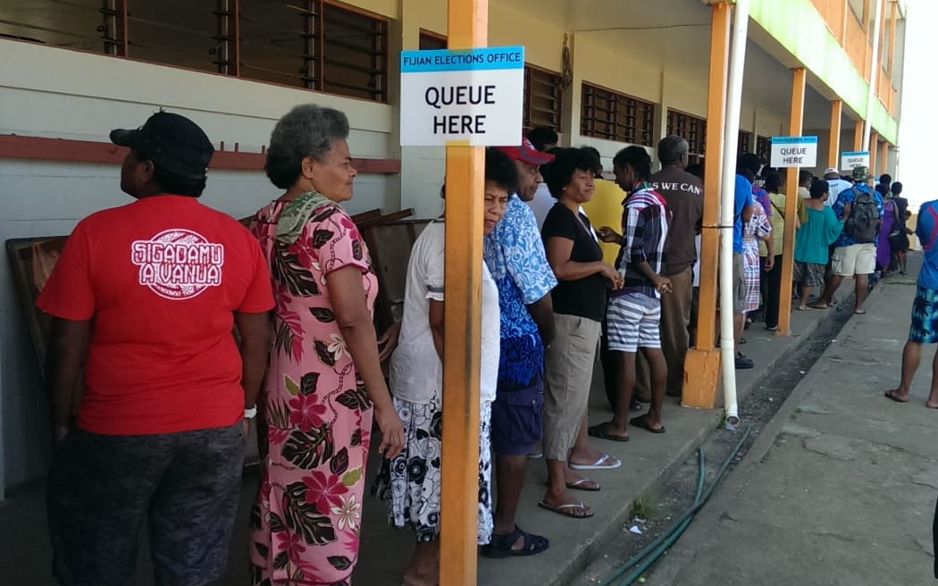 Voters queue at John Wesley College in Fiji