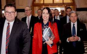 Finance Mrnister Grant Robertson and Prime Minister Jacinda Ardern arrive with Deputy Prime Minister Winston Peters in tow for the release of Budget 2019.