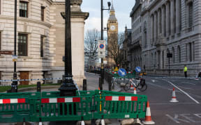 Police take security measures near Parliament square in Westminster, London after a man drove through pedestrians and stabbed a police officer.
