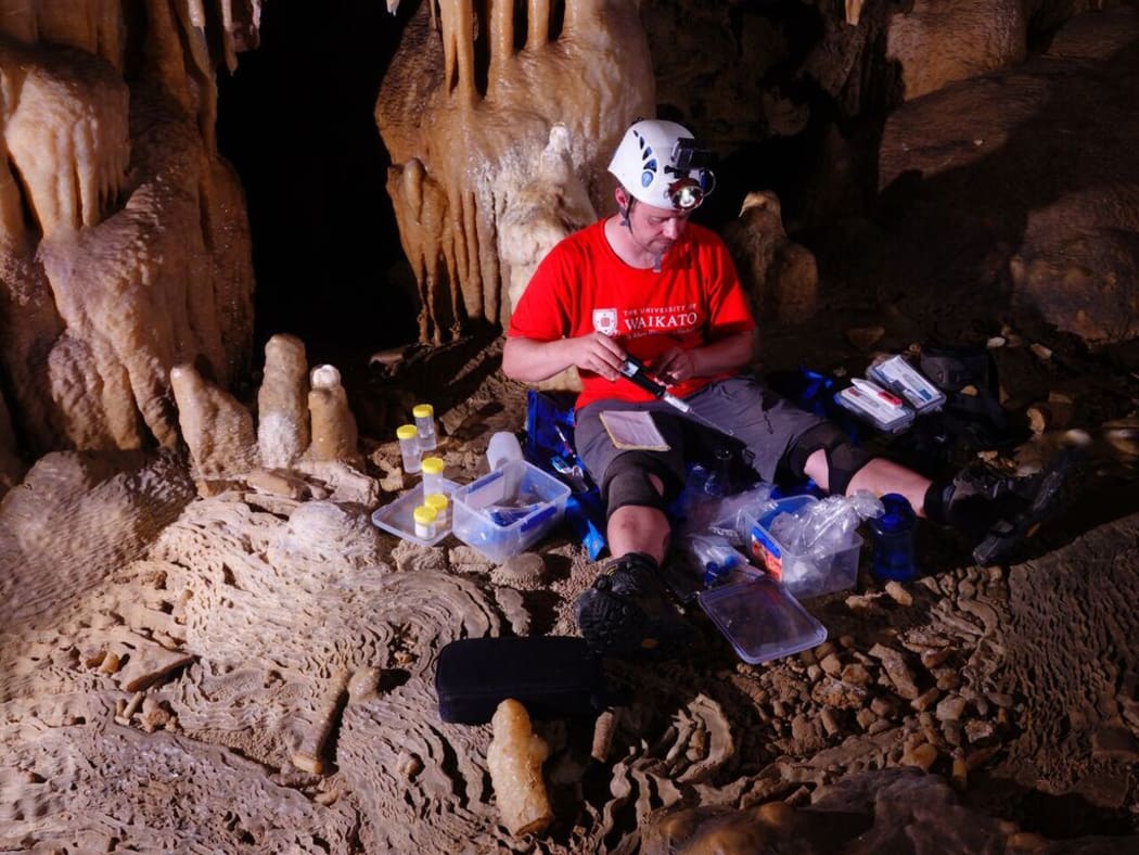 Adam Hartland working in Puatea Cave.