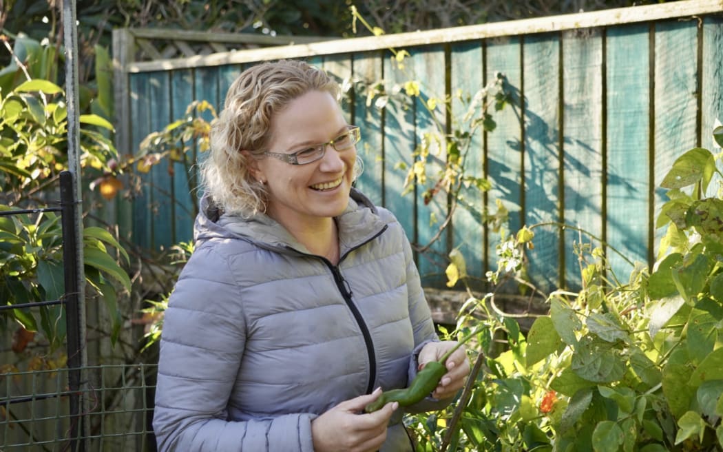 Sarah Grant co-founder of Magic Beans standing in a garden.