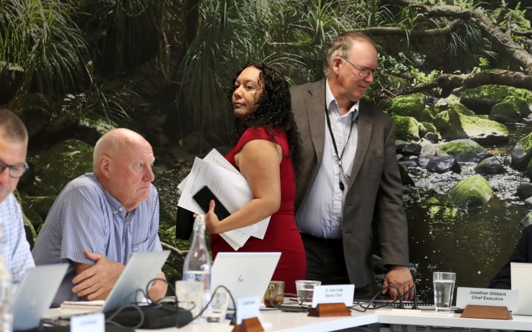 Farmer John Blackwell moves to the top seat where he was NRC chair for about 15 minutes, as newly-resigned chair Tui Shortland exited stage left ahead of Geoff Crawford then shifting into the same council table spot.