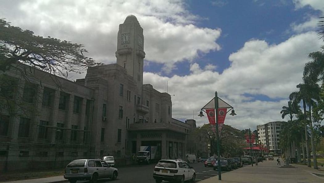 Fiji's refurbished parliament, a stone building with clock tower at entrance