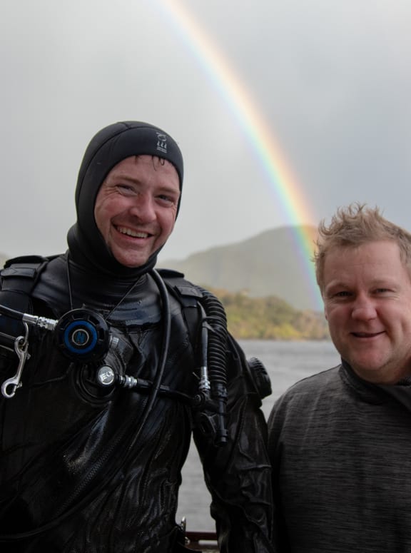 Maritime archaeologist Dr Matt Carter and Will McKee at Facile Harbour, Resolution Island.
