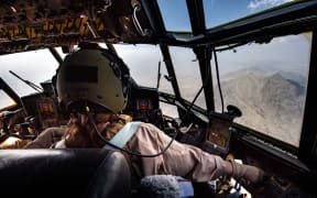 An RNZAF C130 landed in Kabul Afghanistan today and safely evacuated a number of New Zealanders and Australians.

Co-pilot Flight Lieutenant Michal-Louise Repko concentrating on the descent into Kabul.