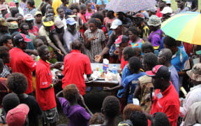 People gather at a stall at the inaugural Bougainville Chocolate Festival