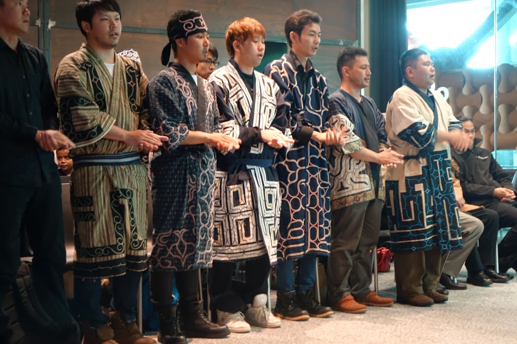 Members of the Ainu delegation perform during the powhiri to welcome them in Taranaki.