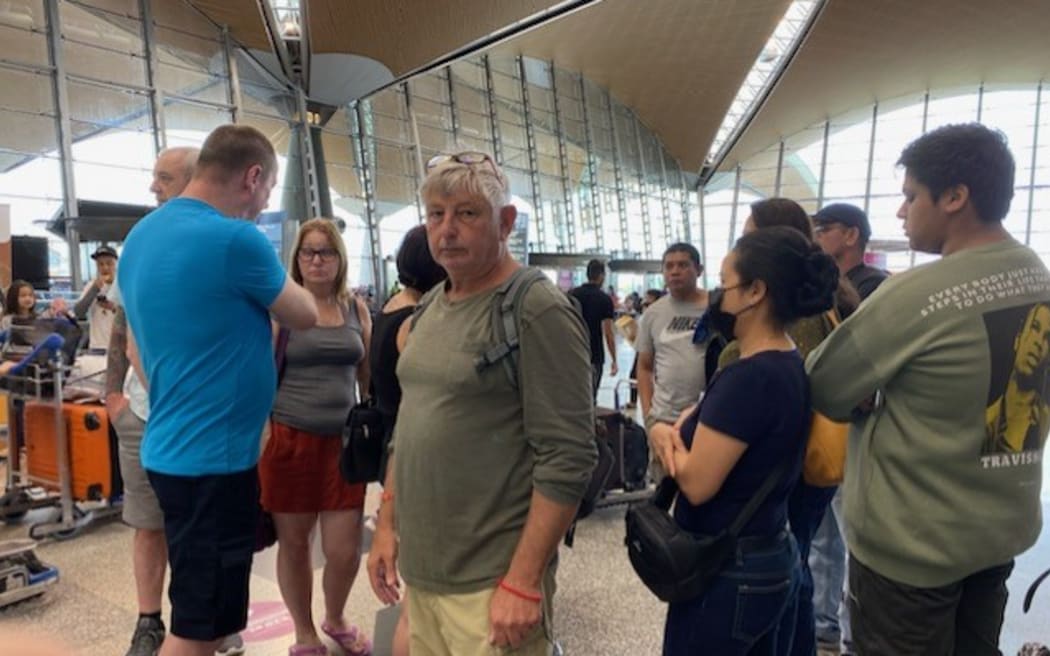 Michael Gunson had trouble with his flight as a result of the flooding at Auckland Airport on Friday, 27 January.