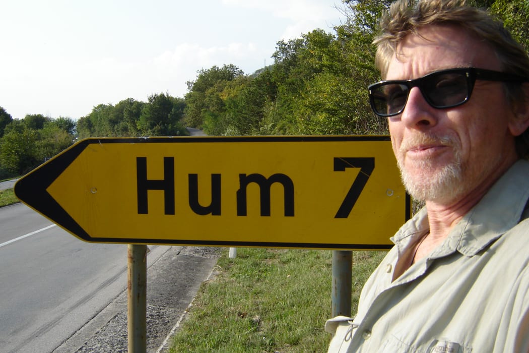 Sound Artist Phil Dadson in tune with a road sign