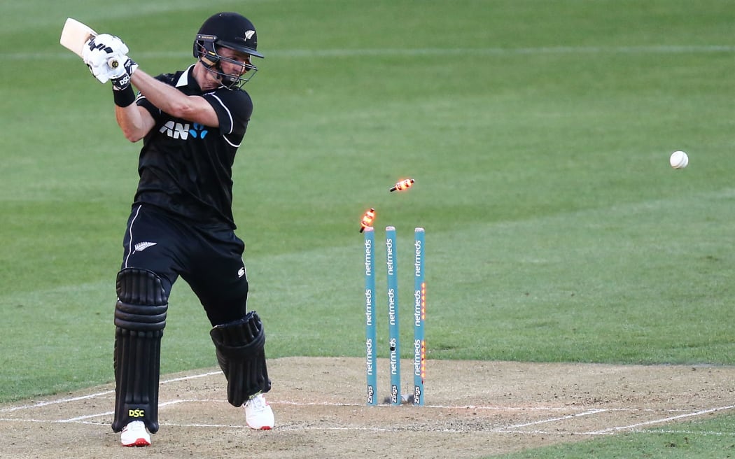 Black Caps opener Colin Munro is bowled in the fifth ODI against India in Wellington.