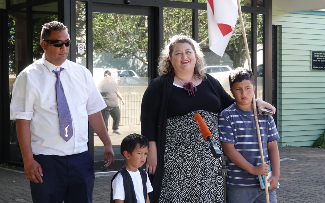 “Tooth Fairy” Claire Wihongi-Matene outside Kaikohe District Court with her husband Anaru Matene and two of their children, Takena Te Upoko Whakaputanga Matene (centre) and Hikurangi Wihongi-Matene (right).