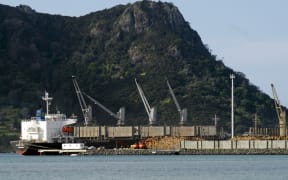 WHANGAREI,NZ - Ship, wood logs and cranes in Northport