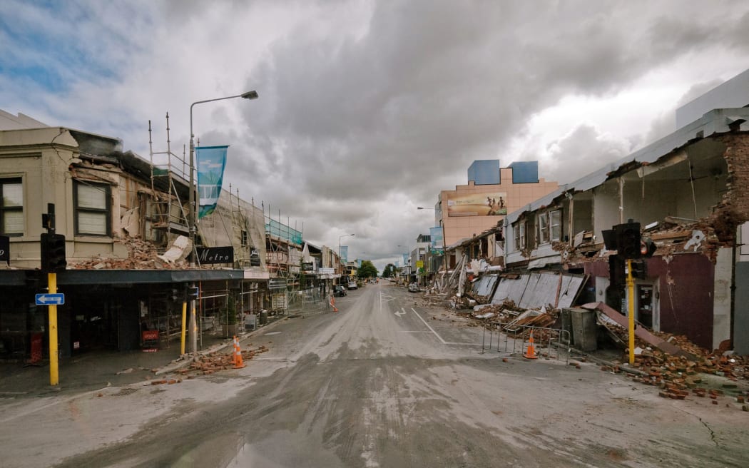 Rubble and damaged buildings line a deserted Colombo street in central Christchurch after the quake.