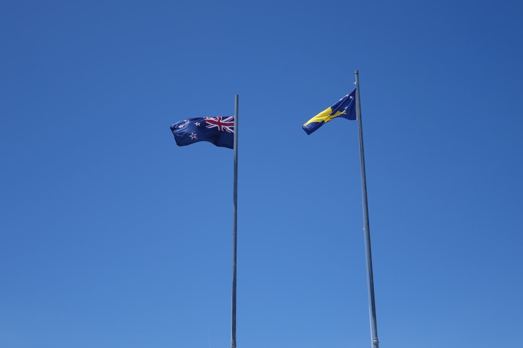 Tokelau and New Zealand flags flying in Atafu, Tokelau