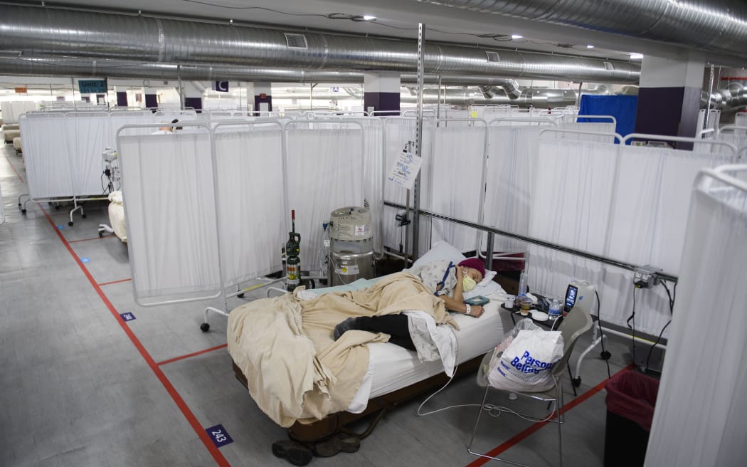 In this file photo taken on December 16, 2020 a patient rests in the Covid-19 alternative care site, built into a parking garage, at Renown Regional Medical Center, in Reno, Nevada.