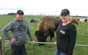 Blair and Nadia Wisely with Bobo the bison.