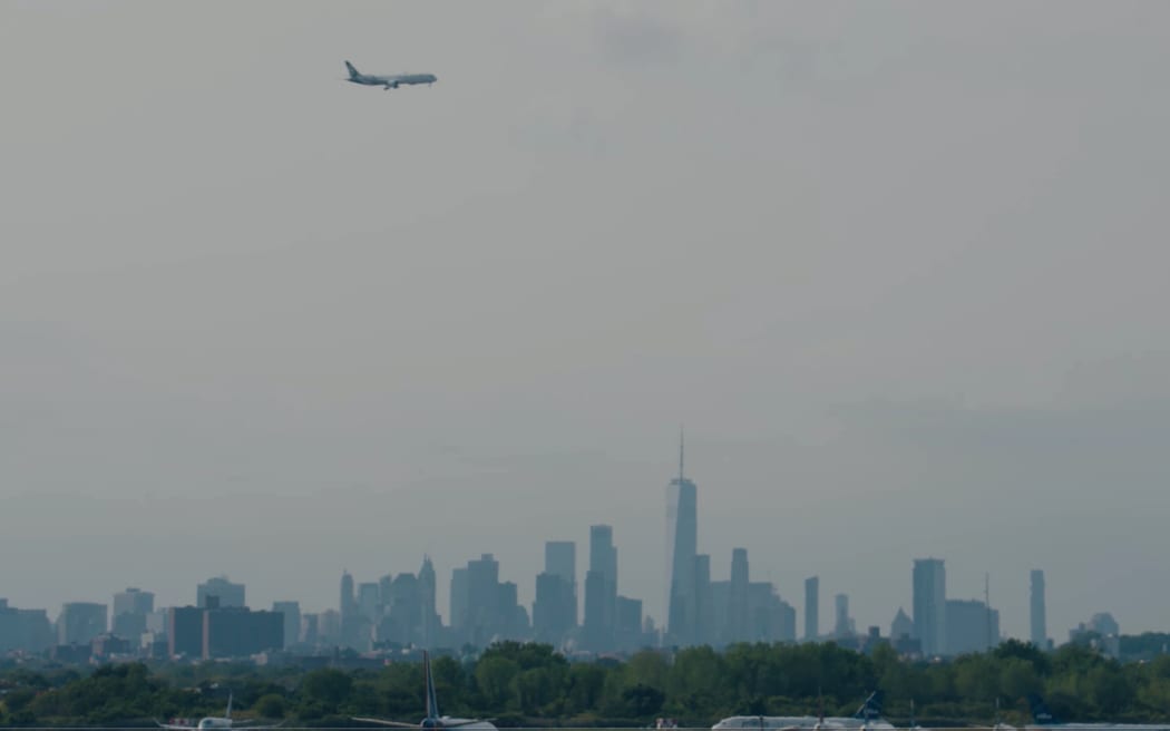 Air New Zealand's inaugural flight NZ2 makes its descent above New York City.