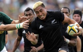 Jerry Collins fends off the tackle during a match against South Africa in 2006.
