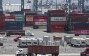 (FILES) In this file photo taken on August 01, 2019 Shipping containers from China and Asia are unloaded at the Long Beach port, California.