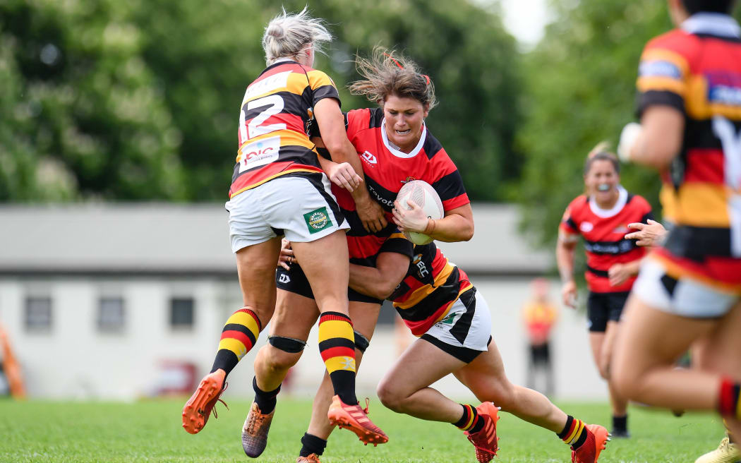 Lucy Anderson of Canterbury is tackled by Chelsea Alley of Waikato during the Farah Palmer Cup Final at Rugby Park, Christchurch, New Zealand, 31st October 2020.