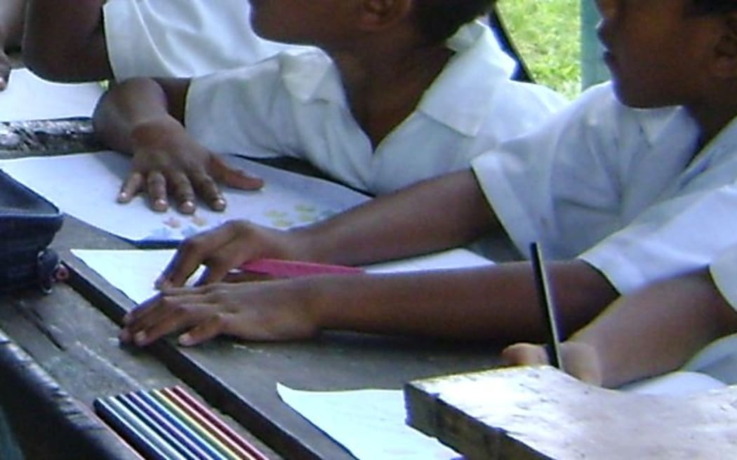 Primary school students in class at Daku School, Fiji