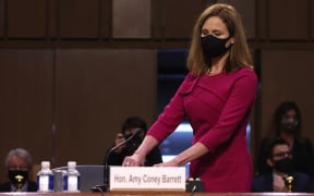 Supreme Court nominee Judge Amy Coney Barrett takes her seat after a break in the Senate Judiciary Committee confirmation hearing on Capitol Hill on October 12, 2020 in Washington, DC.