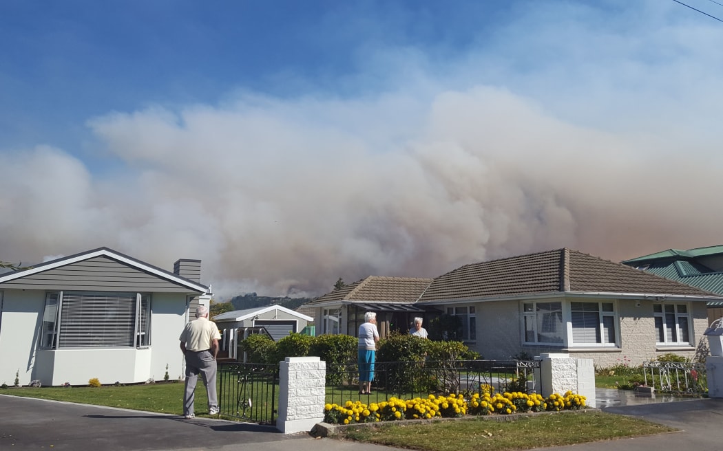 Christchurch residents watch the huge smoke cloud form the Port Hills blaze.