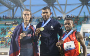 Karan, middle, at the podium with his gold flanked by his closest rivals. 27 November 2023