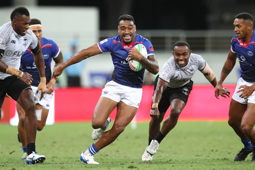 Samoa captain David Afamasaga finds space during their pool match against Fiji in Sydney.