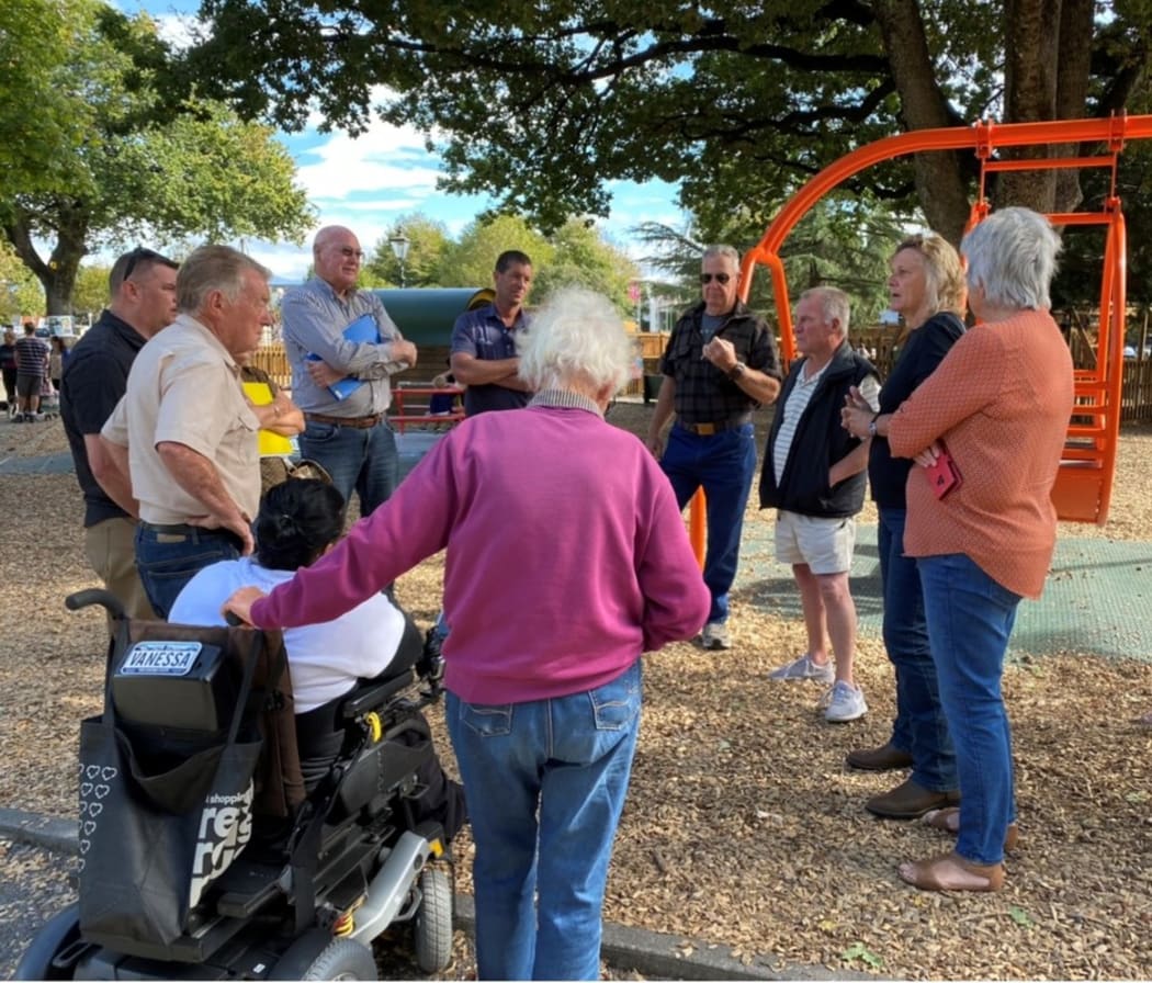 Locals and councillors discuss the tractors' future at Queen Elizabeth Park.