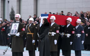 Members of a Turkish forces honour guard carry the Russian flag-draped coffin of late Russian Ambassador to Turkey Andrei Karlov.