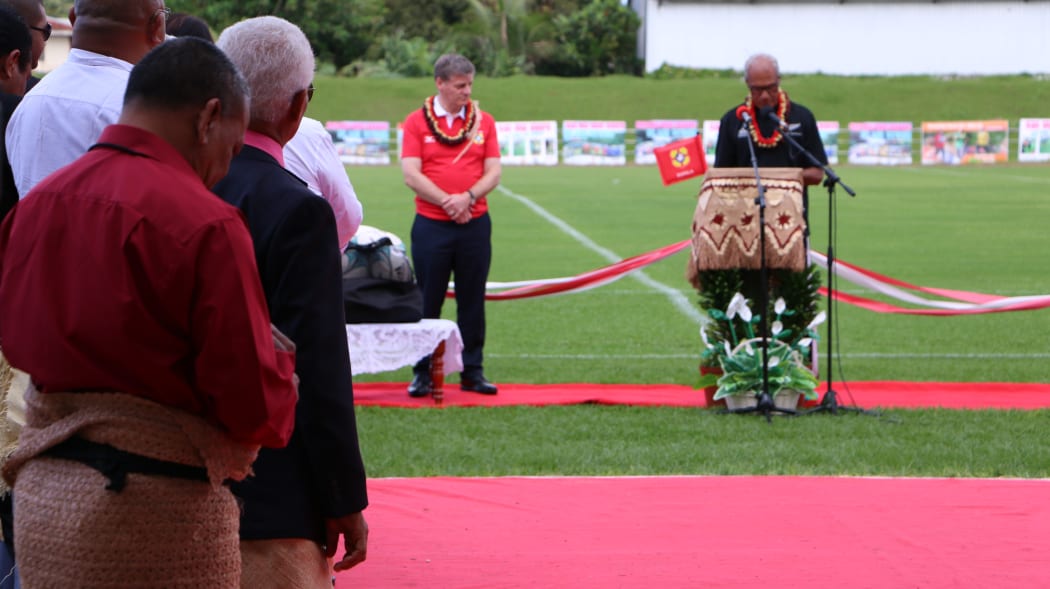 Tonga's prime minister 'Akilisi Pohiva (right) in an All Blacks jersey speaking at the reopening of Teufaiva Stadium in Nuku'alofa as New Zealand prime minister Bill English, in an 'Ikale Tahi jersey looks on. 16 June 2017