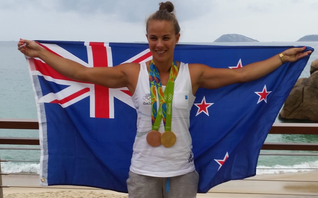 Lisa Carrington with her gold and bronze medals at the Rio Olympics.
