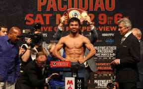 Boxer Manny Pacquiao weighs in for fight against Floyd Mayweather in 2015