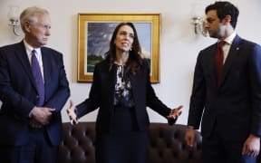 Prime Minister Jacinda Ardern makes brief remarks to reporters before meeting with Senator Angus King (I-ME), left, and Sen. Jon Ossoff (D-GA) in Washington, DC.