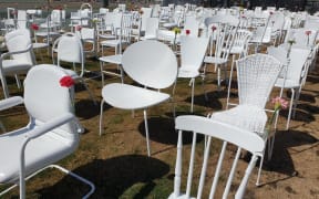 The 185 empty chairs memorial - decked with flowers from yesterday's anniversary.